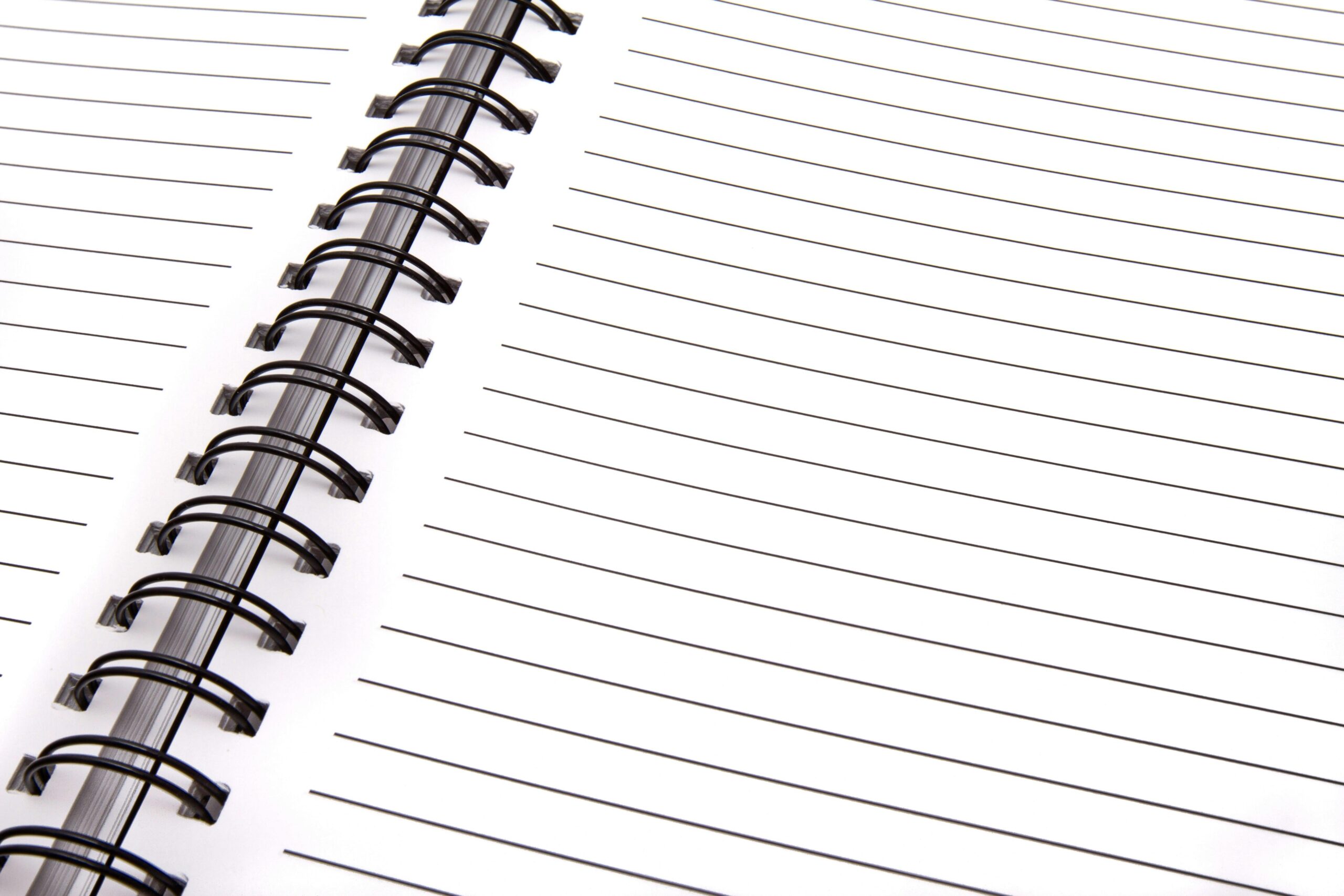 Open spiral notebook with lined pages, perfect for notes and planning.